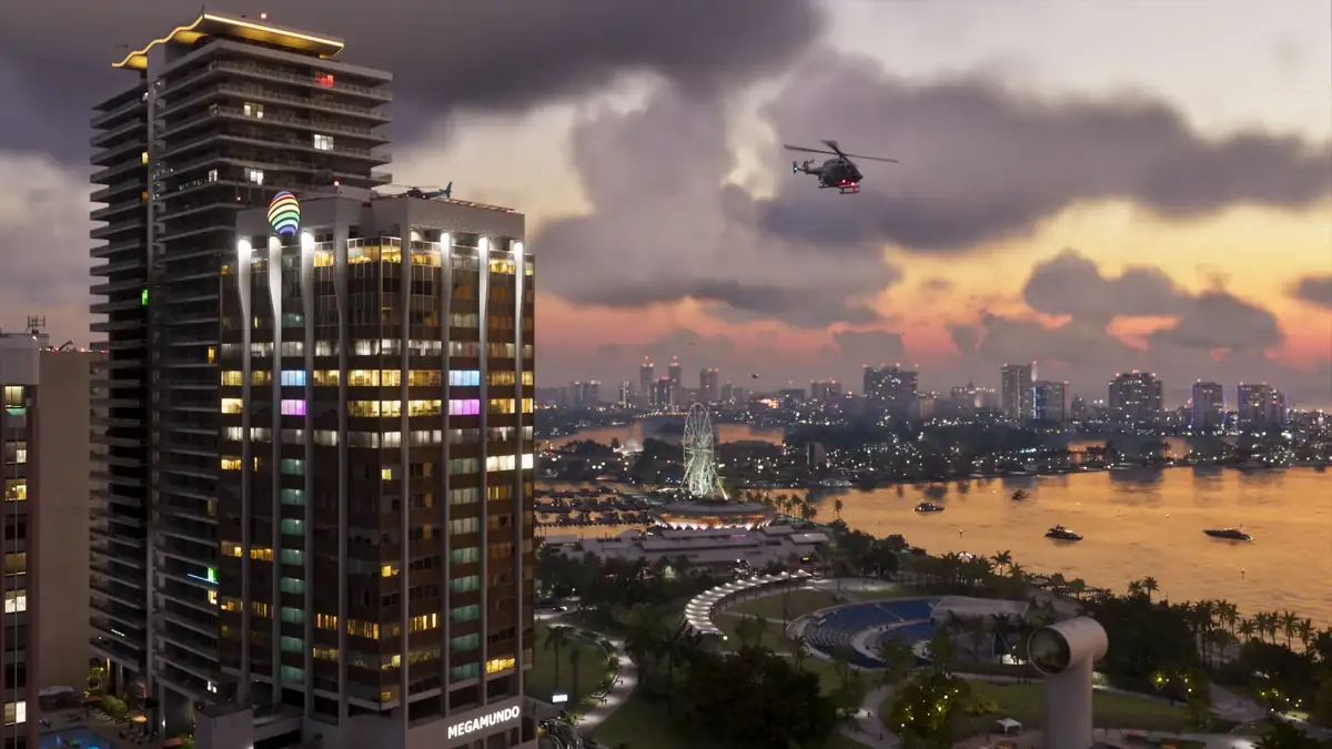 Official GTA VI scene of the Vice City skyline at dusk with a helicopter overhead